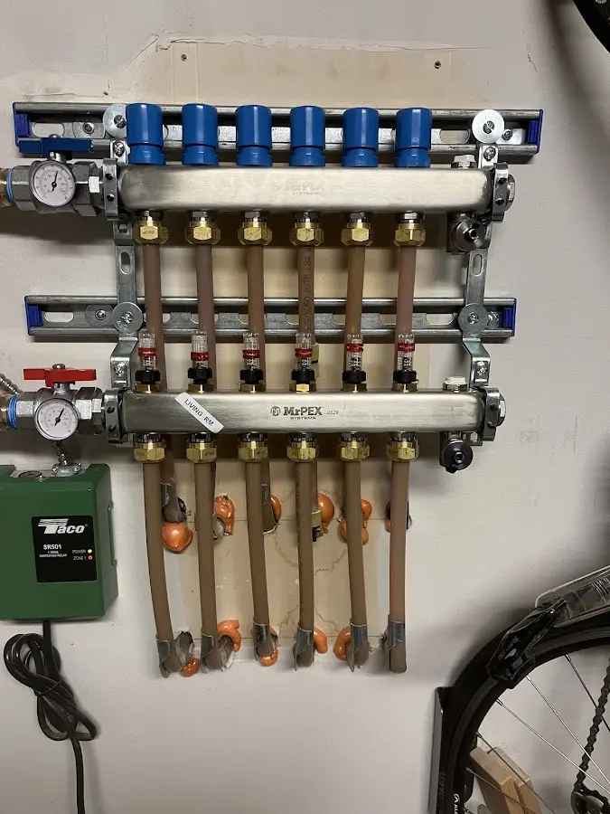 Plumber performing Water Heater Repair at a residential property in Coal City